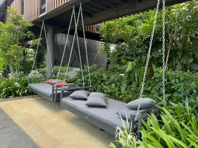 two beds on a swing in a garden at TRION 2, KLCC TRX IKEA at Chan Sow Lin, Kuala Lumpur by One Guesthouse in Kuala Lumpur