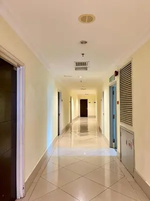 a hallway in a building with a tile floor at Parkview KLCC ITSKAYA 21 NEW in Kuala Lumpur