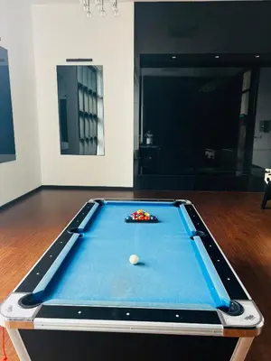 a pool table with a ball on top of it at Chambers Residence KLCC in Kuala Lumpur