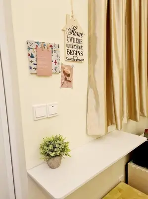 a white shelf with a potted plant and a window at Mini Studio Near Gleneagles 10 mins to KLCC in Kuala Lumpur