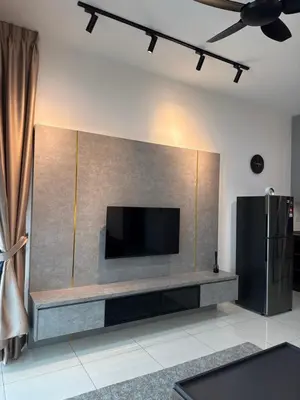 a living room with a flat screen tv on a wall at 2BR Centre MontKiara 4px 500Mbps in Kuala Lumpur