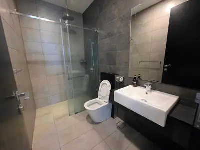 a bathroom with a toilet and a sink and a shower at Opus Residences by Star Haven in Kuala Lumpur