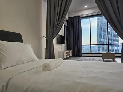 a bedroom with a white bed with a large window at Opus Residences by Star Haven in Kuala Lumpur