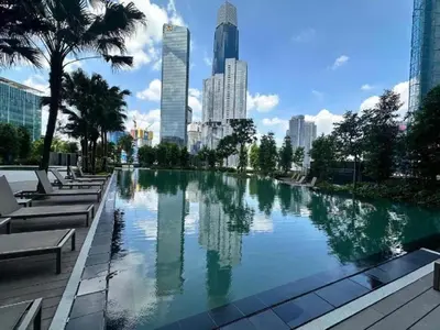 a large swimming pool in a city with tall buildings at Agile Bukit Bintang KLCC in Kuala Lumpur