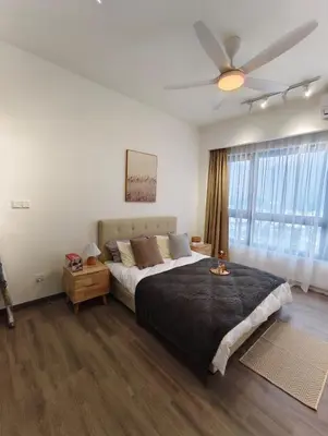 a bedroom with a large bed and a ceiling fan at Agile Bukit Bintang KLCC in Kuala Lumpur