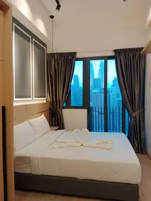 a bedroom with a bed with a heart decoration on it at The Luxe KLCC by NZ in Kuala Lumpur