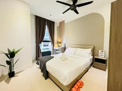 a bedroom with a bed with a ceiling fan at Arcoris Residence Mont Kiara by DeUrban in Kuala Lumpur