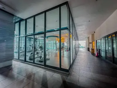 a hallway of a building with large glass windows at Nordic Europe Style in Kuala Lumpur