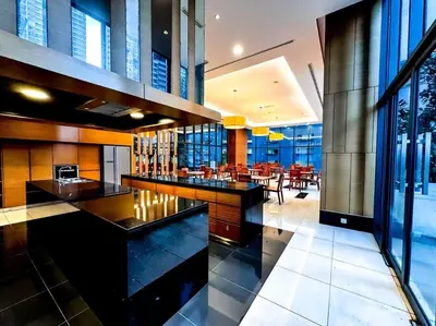 a lobby with a bar and a dining room at Nordic Europe Style in Kuala Lumpur