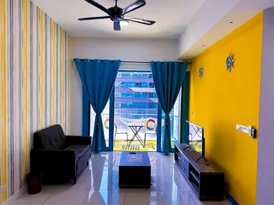 a living room with a couch and a large window at Nordic Europe Style in Kuala Lumpur