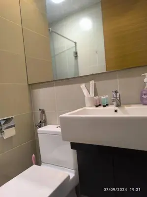 a bathroom with a sink and a toilet and a mirror at 0203 Sweet Home-Casa Residency 2R 2B City View in Kuala Lumpur