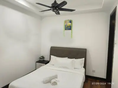 a bedroom with a bed with a ceiling fan at 0203 Sweet Home-Casa Residency 2R 2B City View in Kuala Lumpur