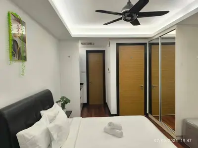 a bedroom with a bed with a ceiling fan at 0203s Sweet Home-Casa Residency in Kuala Lumpur