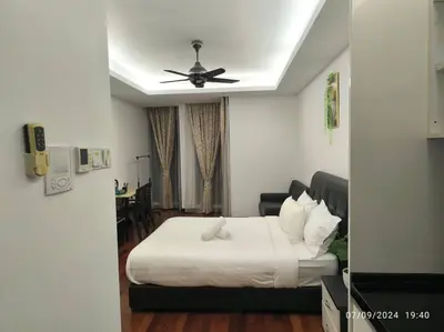 a bedroom with a bed and a ceiling fan at 0203s Sweet Home-Casa Residency in Kuala Lumpur