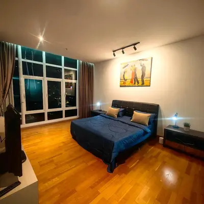 a bedroom with a bed and a large window at KL Sentral Dua Sentral King Bedroom Suite With Merdeka 118 and KLCC View #FreeParking in Kuala Lumpur