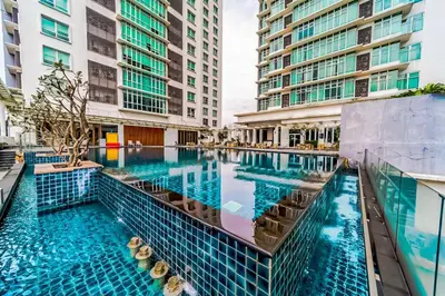 a swimming pool in a building with tall buildings at KL Sentral Dua Sentral King Bedroom Suite With Merdeka 118 and KLCC View #FreeParking in Kuala Lumpur