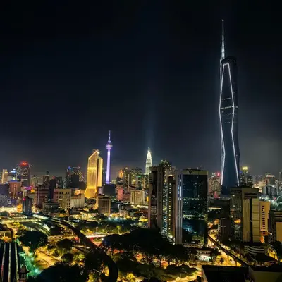 a view of a city skyline at night at KL Sentral Dua Sentral King Bedroom Suite With Merdeka 118 and KLCC View #FreeParking in Kuala Lumpur
