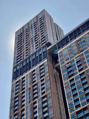 a tall building with many windows on top of it at 1BR condo with Amazing KLCC View & Infinity Pool at Lalaport Bukit Bintang in Kuala Lumpur