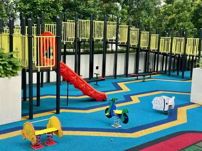 a playground with a red slide and play equipment at KL Central 31st floor KLCC view in Kuala Lumpur