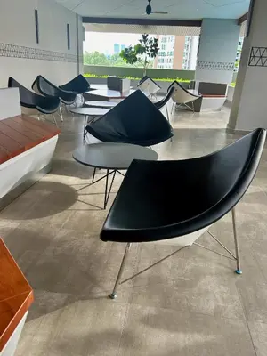 a group of tables and chairs in a room at KL Central 31st floor KLCC view in Kuala Lumpur