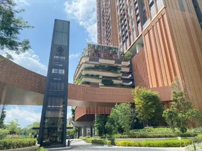 a building with a clock tower in front of it at Studio with Amazing KLCC View & Infinity Pool at Lalaport Bukit Bintang in Kuala Lumpur