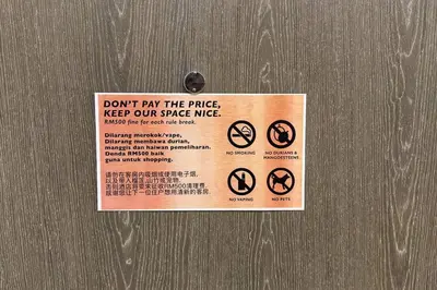 a sign on a door that says dont play the fence keep our place nice at Star Xtian Residence KLCC in Kuala Lumpur