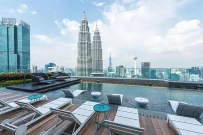 a swimming pool on the roof of a building at Star Xtian Residence KLCC in Kuala Lumpur