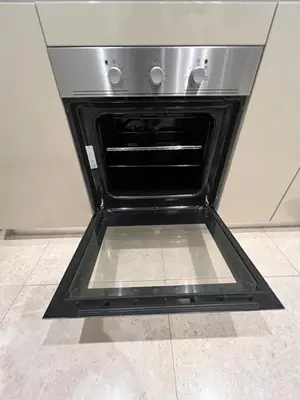 an oven with its door open in a kitchen at Lucentia Residence Bukit Bintang by Ideal Homes in Kuala Lumpur