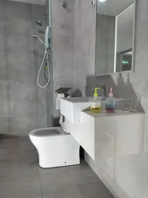 a bathroom with a toilet and a sink and a mirror at Riveria City KL Sentral by Jane in Kuala Lumpur