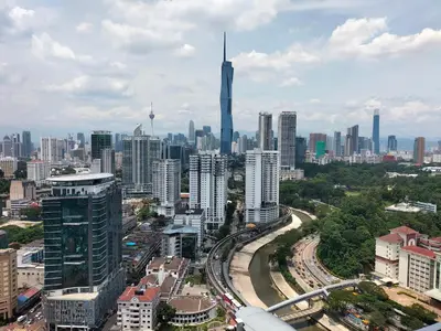a view of a city with a tall skyscraper at Riveria City KL Sentral by Jane in Kuala Lumpur