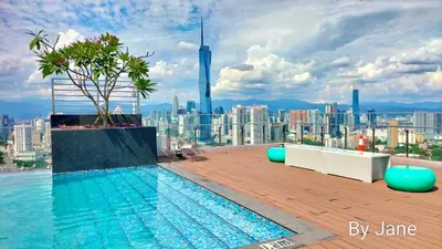 a swimming pool on the roof of a building at Riveria City KL Sentral by Jane in Kuala Lumpur