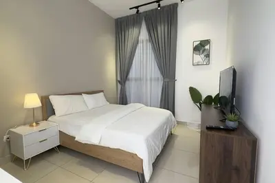 a bedroom with a bed and a television in it at Cozy studio service suite Free parking Netflix Trion B5206 KL in Kuala Lumpur