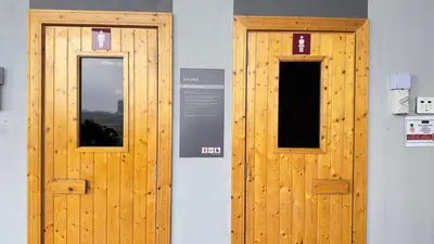 two wooden doors on the side of a building at Cozy studio service suite Free parking Netflix Trion B5206 KL in Kuala Lumpur