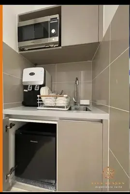 a kitchen with a sink and a microwave at trion2 Kuala lumper near KLCC TRX bukit bin tang in Kuala Lumpur