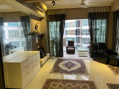 a living room with a large window and a couch and a chair at Celestial Heights Hostel featuring Infinity Skypool in Kuala Lumpur