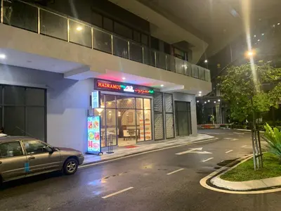 a car parked in front of a building at night at Rainbowstudioklcc in Kuala Lumpur