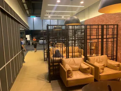 a room with chairs and tables in a building at Rainbowstudioklcc in Kuala Lumpur