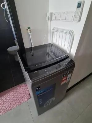 a small refrigerator with a sink in a room at Neu Suites Studio 10mins to KLCC in Kuala Lumpur