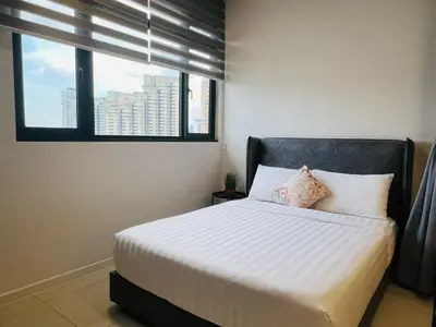 a bedroom with a white bed with a window at Chambers Suites KLCC By City Homes in Kuala Lumpur