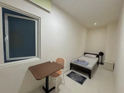a small room with a table and a window at ABC PRiVATE RooM Klcc in Kuala Lumpur