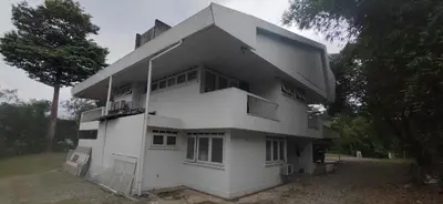 a white building with a lot of windows at Taman Duta KL Deluxe Villa by uBook in Kuala Lumpur