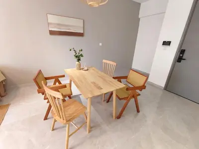 a dining room with a wooden table and chairs at Agile Bukit Bintang KLCC City Centre Kuala Lumpur Malaysia in Kuala Lumpur