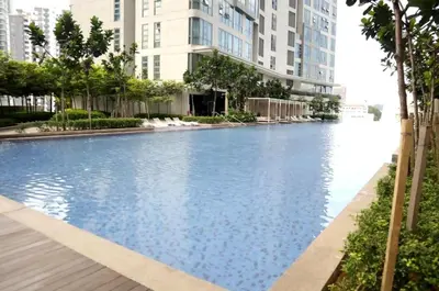 a swimming pool in a city with tall buildings at Pool World at Robertson Residence Kuala Lumpur in Kuala Lumpur