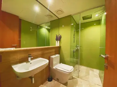 a bathroom with a sink and a toilet and a shower at Apartment Sky by MonoSuites KLCC in Kuala Lumpur