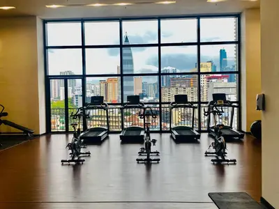 a gym with a view of a city skyline at Chamber Suites By Kuala Lumpur in Kuala Lumpur