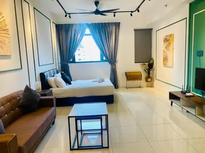 a living room with a bed and a couch at Chamber Suites By Kuala Lumpur in Kuala Lumpur