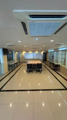 a conference room with a table and benches in it at South of The Clouds HOTEL KL Sentral \u5409\u9686\u5761\u5f69\u4e91\u4e4b\u5357\u9152\u5e97-\u4e2d\u592e\u8f66\u7ad9\u5e97 in Kuala Lumpur
