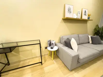 a living room with a couch and a table at Family comfy 2BR at Star residence2 KLCC in Kuala Lumpur