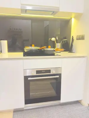 a kitchen with a counter top with a oven at Family comfy 2BR at Star residence2 KLCC in Kuala Lumpur