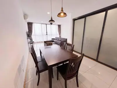 a dining room with a table and chairs and a couch at PROMO Connected train 3 Bedrooms - Above Mall 25 in Kuala Lumpur